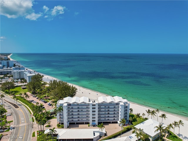 aerial view featuring a view of the beach and a water view