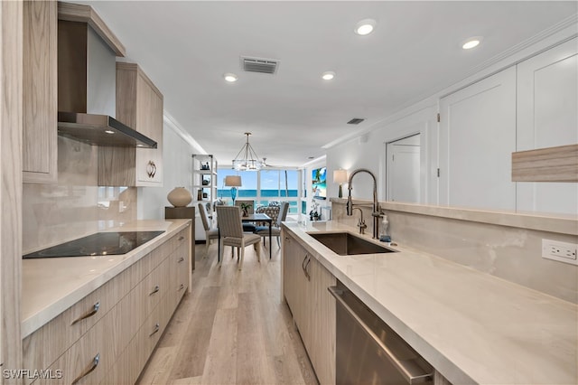 kitchen with sink, crown molding, dishwasher, hanging light fixtures, and wall chimney exhaust hood