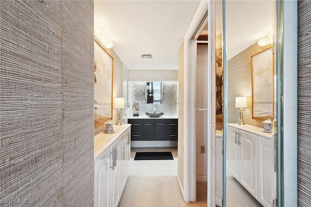 bathroom with vanity and tile patterned floors