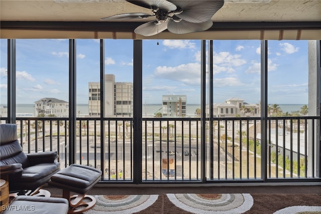 sunroom featuring ceiling fan