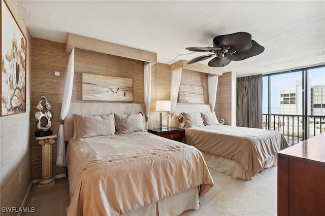 bedroom with access to exterior, light colored carpet, and ceiling fan