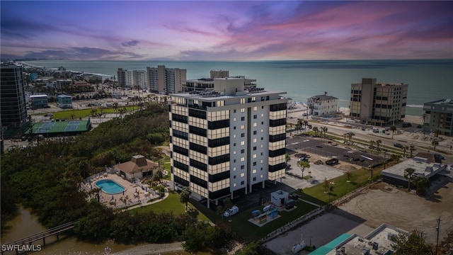 aerial view at dusk with a water view