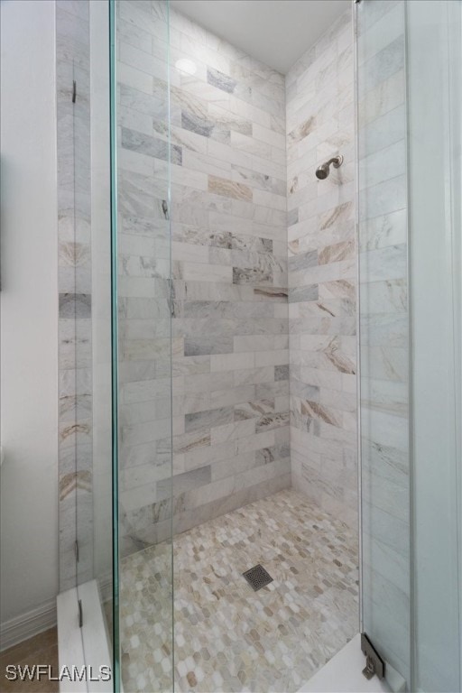 full bath featuring a shower stall