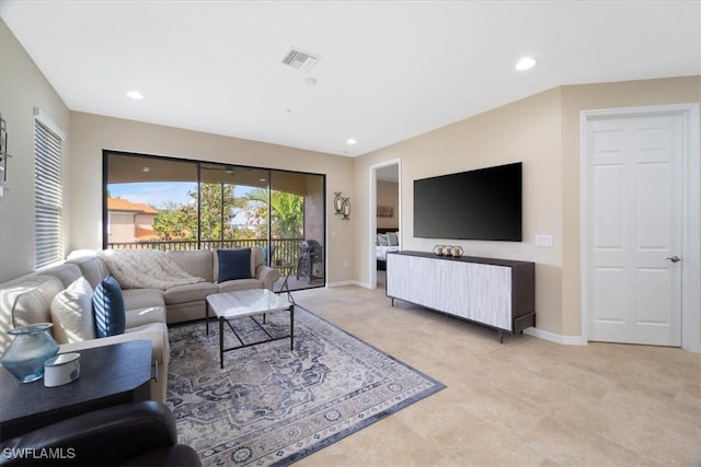 living room featuring recessed lighting, visible vents, and baseboards