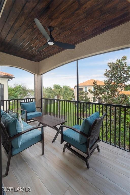 wooden deck featuring ceiling fan and outdoor lounge area