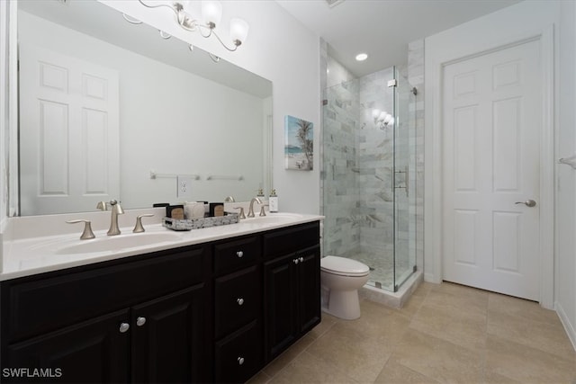 bathroom featuring vanity, tile patterned flooring, a shower with shower door, and toilet