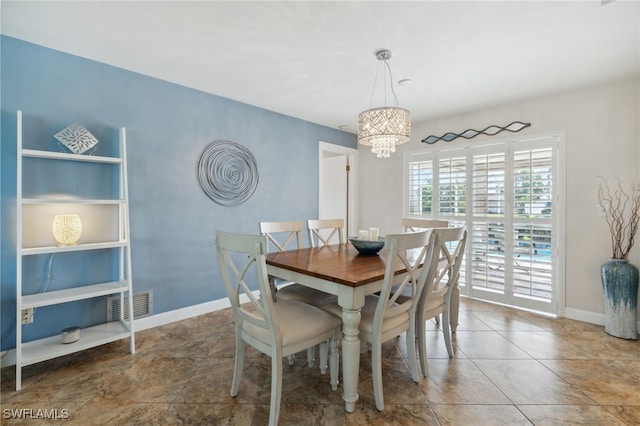 dining space featuring a chandelier