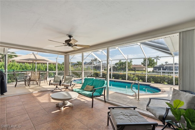 view of swimming pool featuring an outdoor hangout area, a patio, ceiling fan, and a lanai