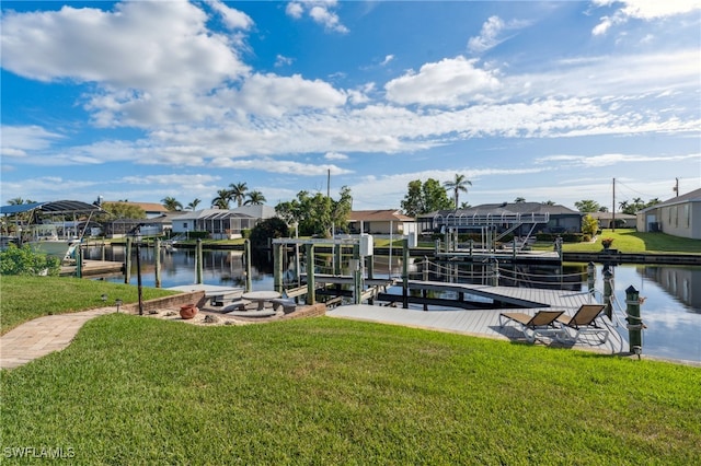 dock area with a yard and a water view