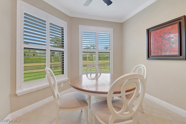 dining room with ceiling fan, light tile patterned floors, and crown molding