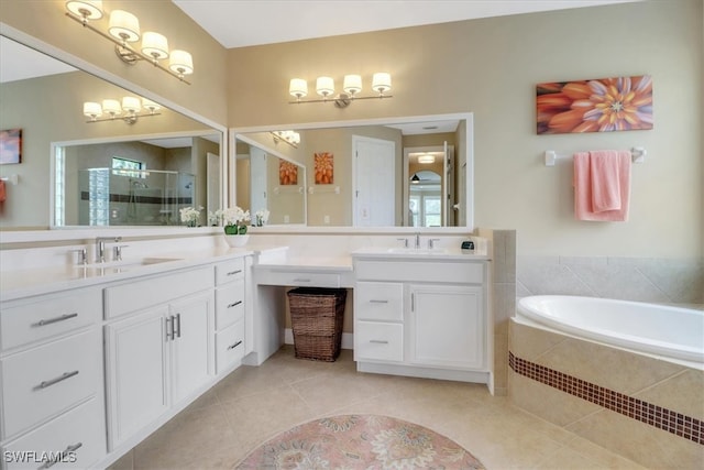 bathroom with tile patterned flooring, vanity, and shower with separate bathtub