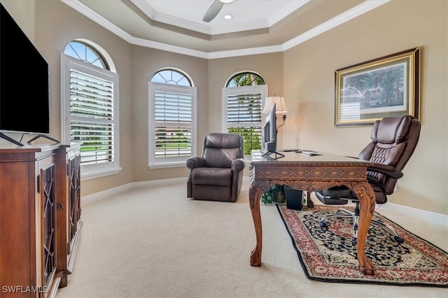 carpeted office featuring crown molding and ceiling fan