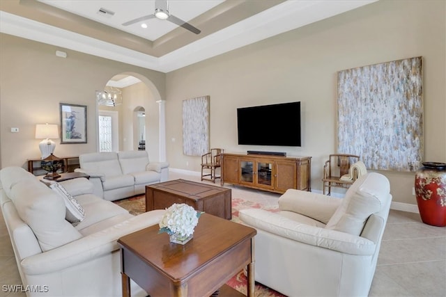 tiled living room with ceiling fan