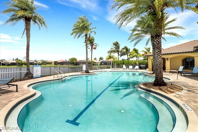 view of swimming pool with a patio