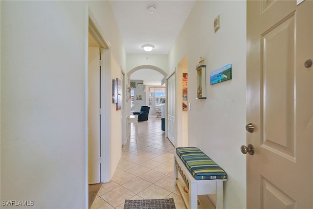 hall featuring light tile patterned floors