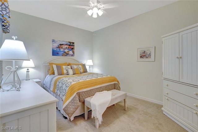 bedroom featuring light carpet and ceiling fan