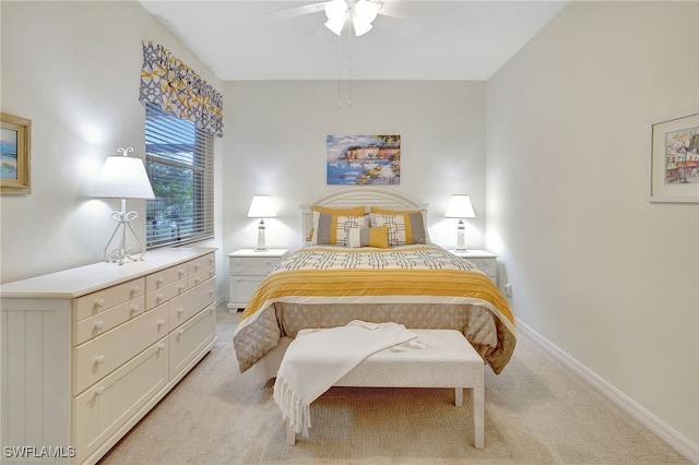 bedroom featuring ceiling fan and light colored carpet