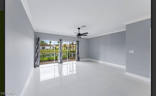 tiled empty room featuring ceiling fan and ornamental molding