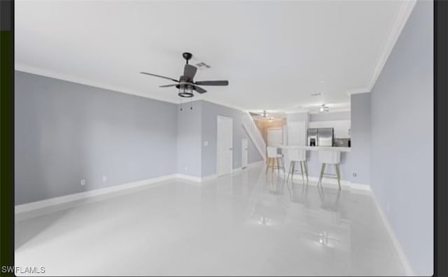 unfurnished living room featuring ceiling fan and crown molding