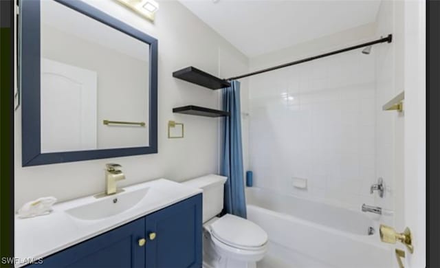 full bathroom featuring vanity, toilet, and shower / bath combination with curtain