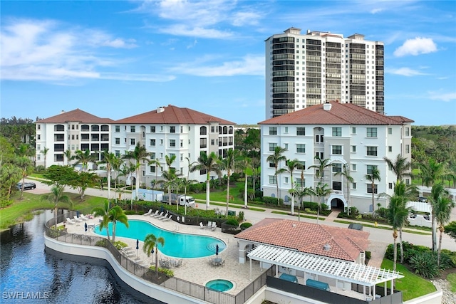 view of pool featuring a water view