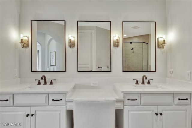 bathroom with an enclosed shower and vanity