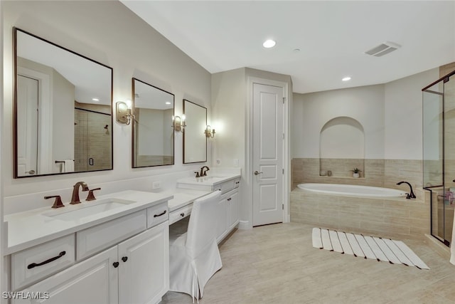 bathroom with plus walk in shower and vanity