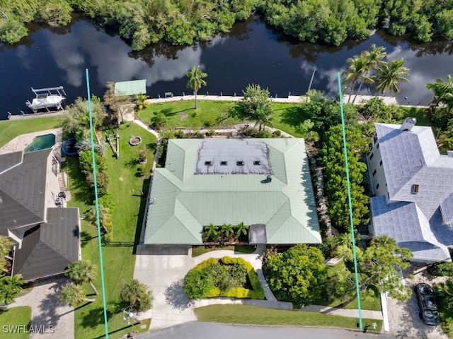 birds eye view of property with a water view