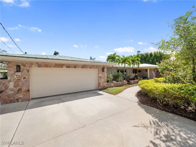 single story home featuring a garage