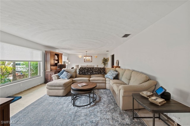 living room featuring a chandelier