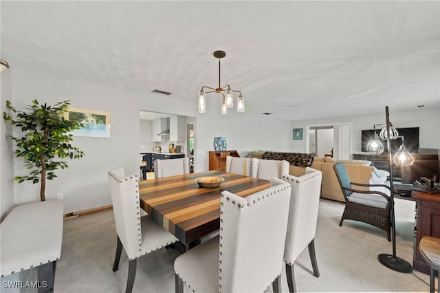 dining room featuring a notable chandelier