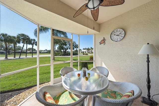 sunroom / solarium with plenty of natural light and ceiling fan