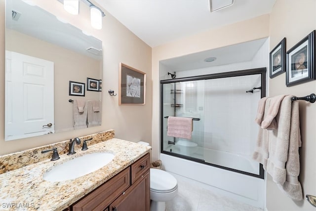 full bathroom with toilet, combined bath / shower with glass door, vanity, and tile patterned floors