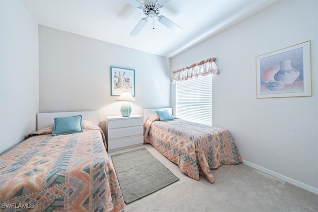 bedroom featuring lofted ceiling, light carpet, and ceiling fan