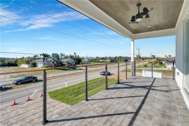 view of patio with a balcony and ceiling fan