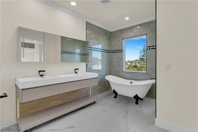 bathroom with crown molding, a bathtub, and vanity