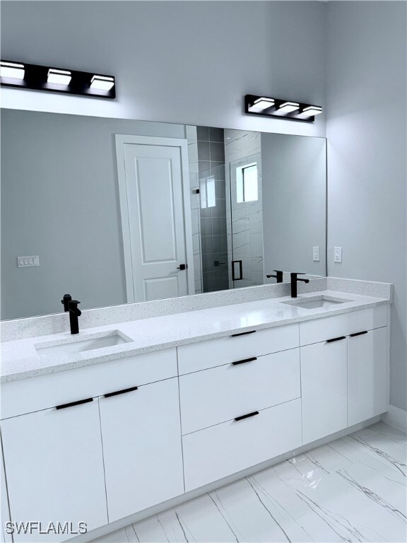 bathroom with vanity and an enclosed shower