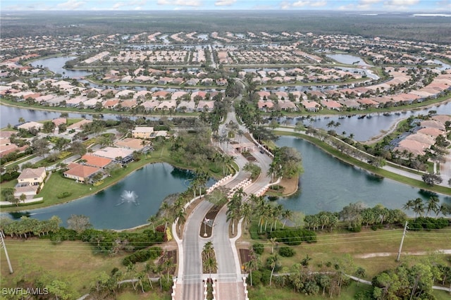 bird's eye view with a residential view and a water view