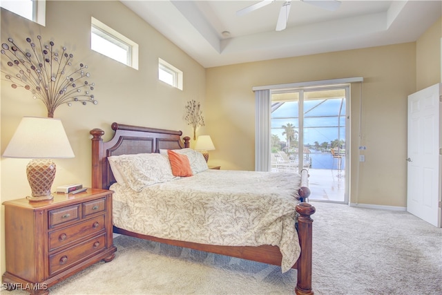 bedroom featuring ceiling fan, light colored carpet, multiple windows, and access to outside