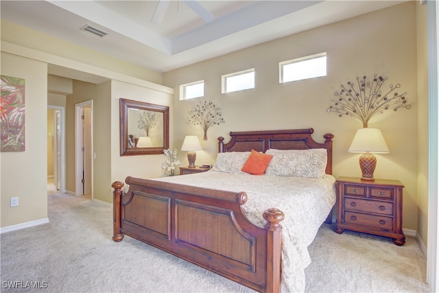 bedroom featuring light carpet and ceiling fan