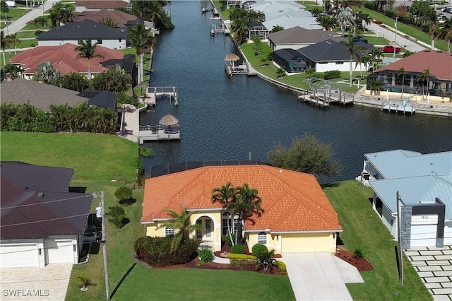 birds eye view of property with a water view