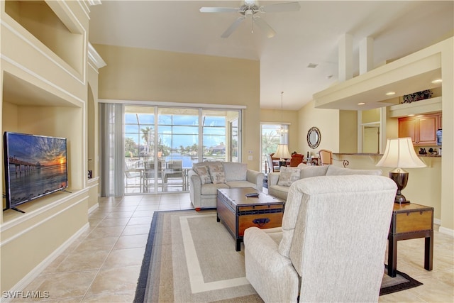 living room featuring light tile patterned floors and ceiling fan