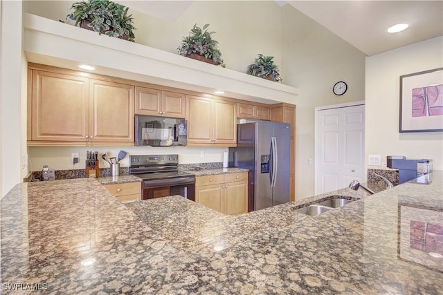 kitchen featuring black appliances, stone countertops, high vaulted ceiling, sink, and kitchen peninsula