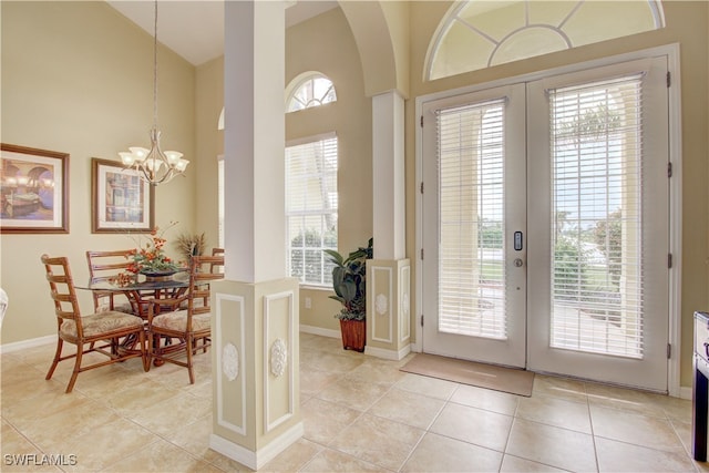 doorway to outside featuring french doors, light tile patterned flooring, and plenty of natural light