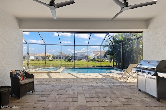 view of pool featuring glass enclosure, ceiling fan, a patio area, an in ground hot tub, and area for grilling