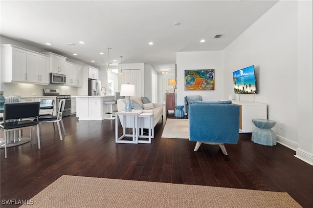 living room featuring dark hardwood / wood-style flooring