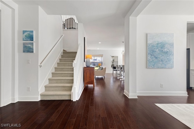 foyer with dark wood-type flooring