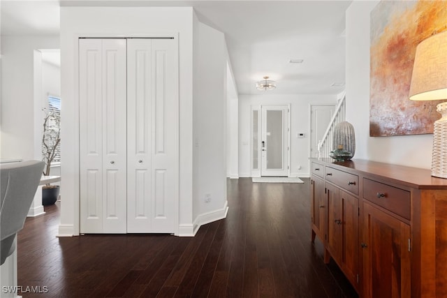 hall with dark hardwood / wood-style floors