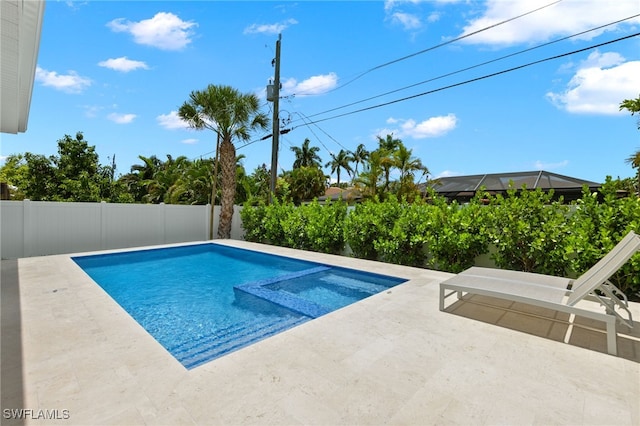 view of swimming pool with a patio area