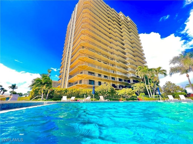 view of pool with pool water feature